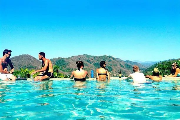 A peaceful infinity pool reflecting the sky at a couples retreat, inviting partners to relax and immerse themselves in the Strengthen Your Relationship Couples Retreat experience, designed to rebuild trust and closeness.