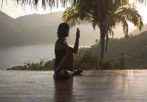 A couple engaged in guided relationship-building exercises in an open-air sanctuary, part of the Hold Me Tight Couples Workshop in Mexico, where partners deepen their emotional connection through structured conversations.