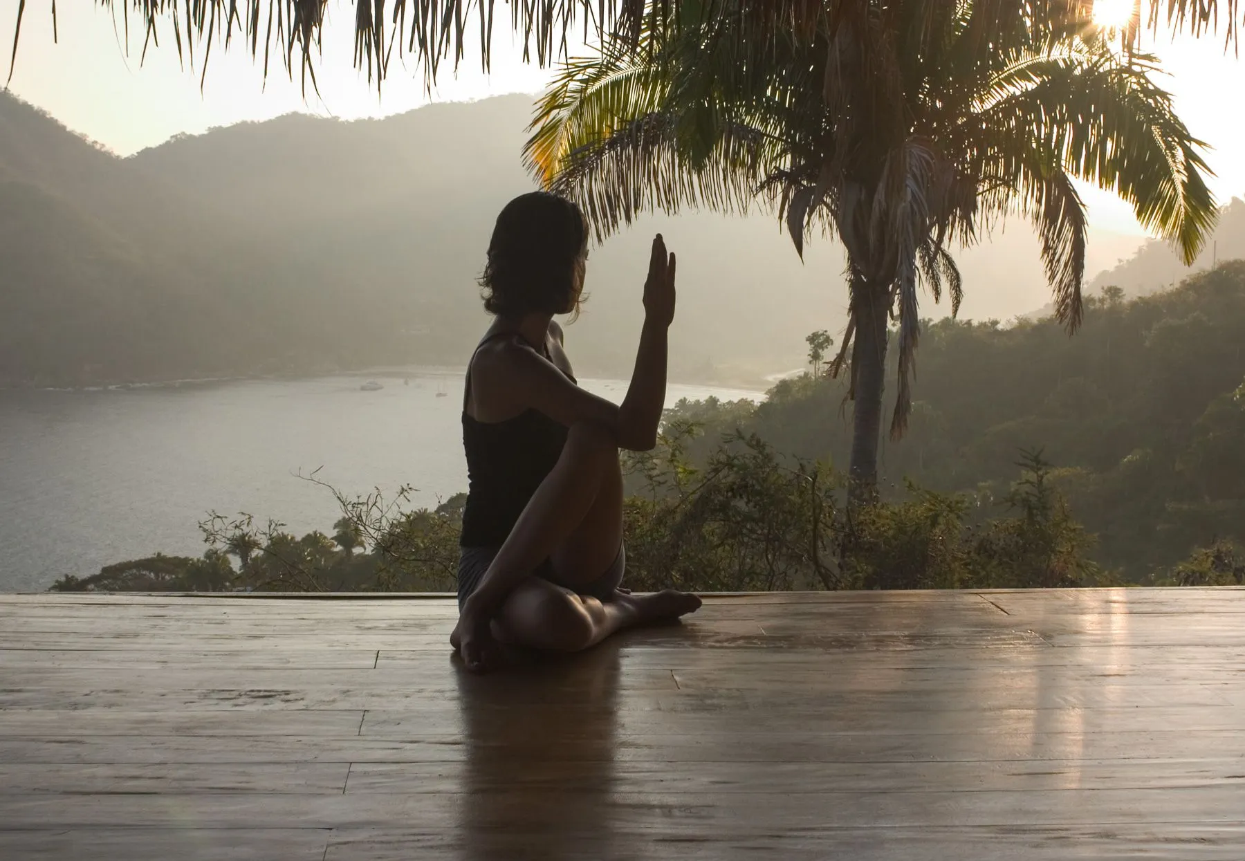 A couple engaged in guided relationship-building exercises in an open-air sanctuary, part of the Hold Me Tight Couples Workshop in Mexico, where partners deepen their emotional connection through structured conversations.