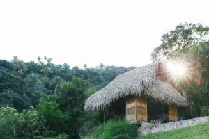 A secluded open-air bungalow at a private couples retreat in Verana, offering breathtaking ocean views and a peaceful escape for partners.