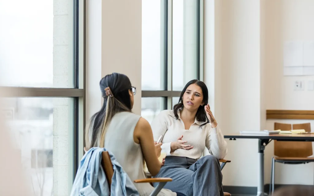 Emotionally-attuned-therapists-in-Los-Angeles A therapy session in progress where both the client and therapist are emotionally attuned, shown through their body language and facial expressions