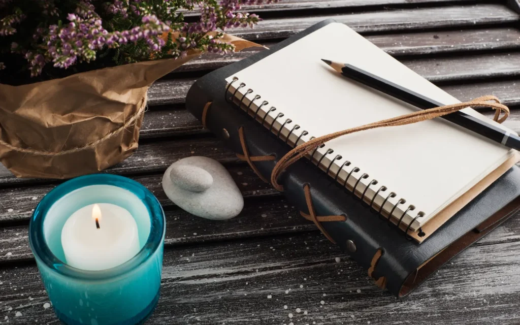 A journal on a wooden table, representing the value of journaling during couples therapy
