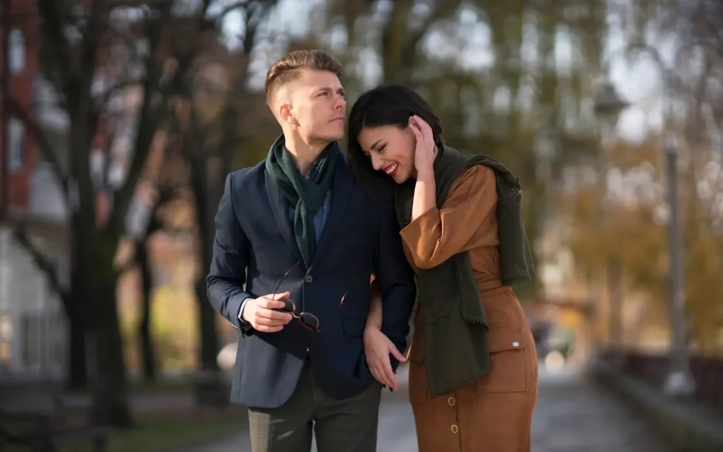 Secure-attachment-through-couples-therapy A couple walking through a town arm in arm, representing secure attachment in relationships