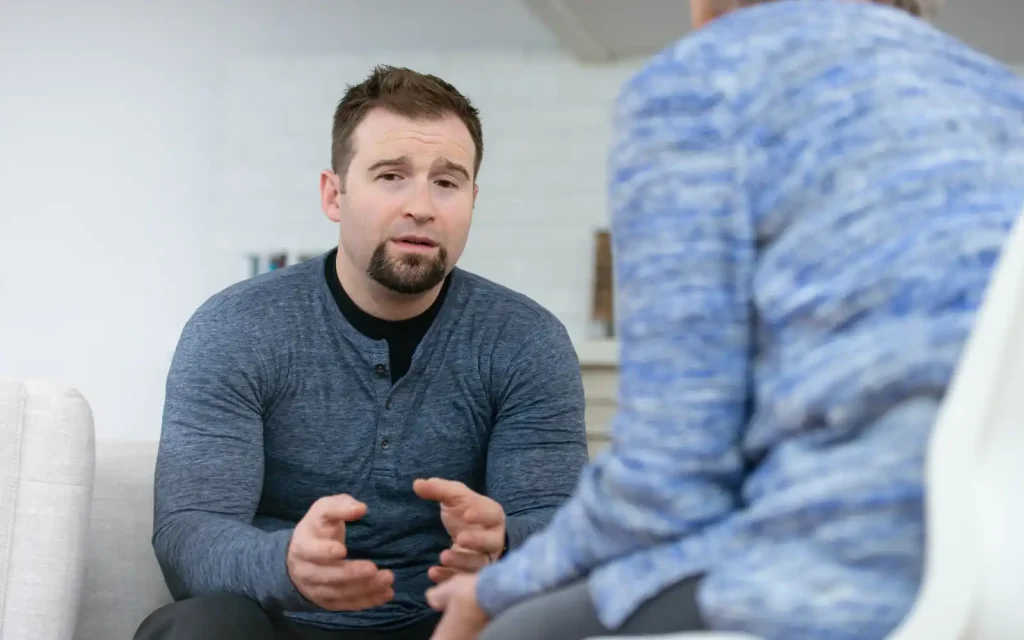 Boundaries-in-Los-Angeles-therapy A man looking uncomfortable in a therapy session in Los Angeles, demonstrating why professional boundaries must be maintained