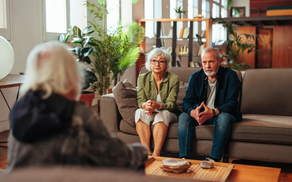 Couples-therapist-in-LA An older couple looking at their couples therapist with a serious look on their face