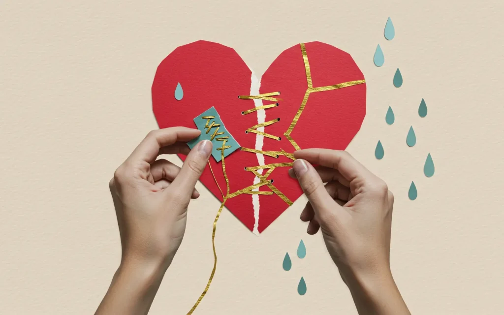 Healing-relationships-through-Los-Angeles-Couples-Therapy A ripped paper heart being sewn back together, representing the healing of relationships through Los Angeles couples therapy