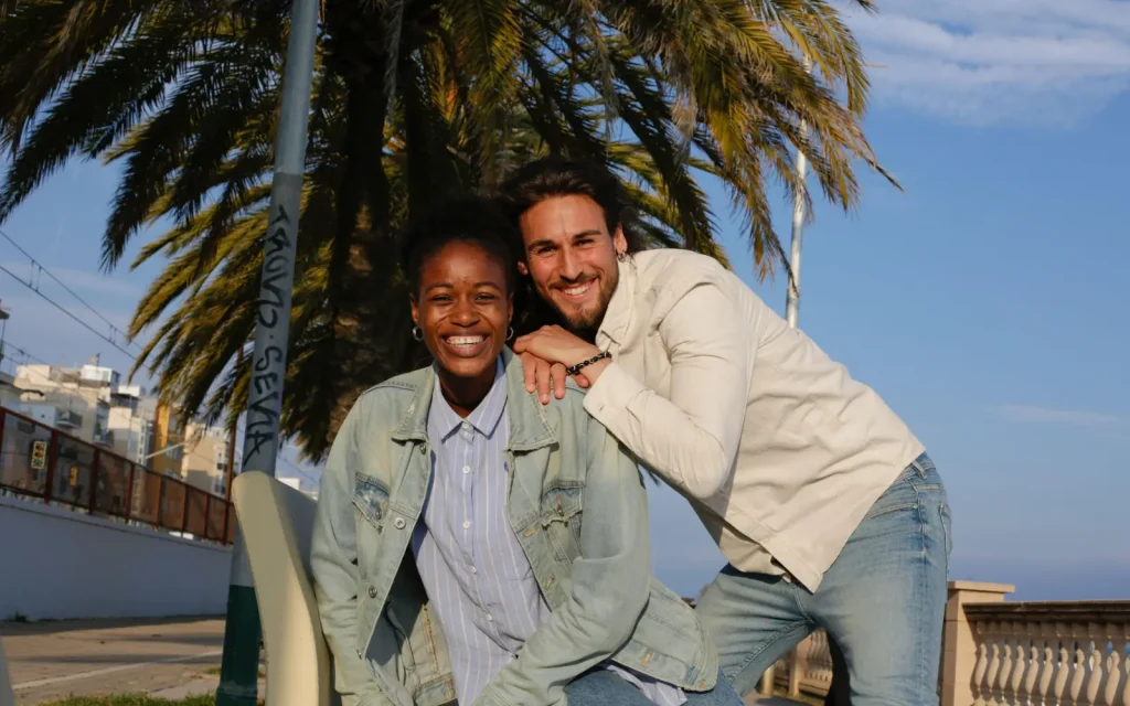An interracial couple smiling outside in Los Angeles, representing the impact of GGPA's interracial marriage counseling