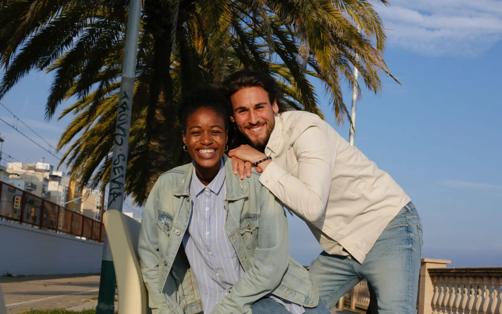 An interracial couple smiling outside in Los Angeles, representing the impact of GGPA's interracial marriage counseling services on couples