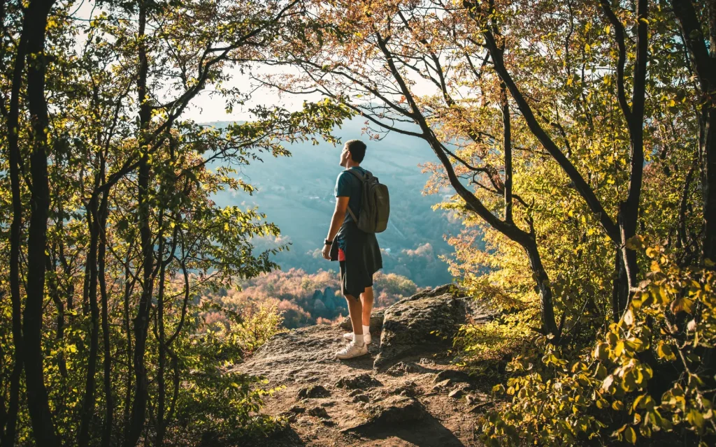 Young-men-seeking-therapy-in-Los-Angeles A man hiking outdoors, representing the rise in young men seeking therapy in LA