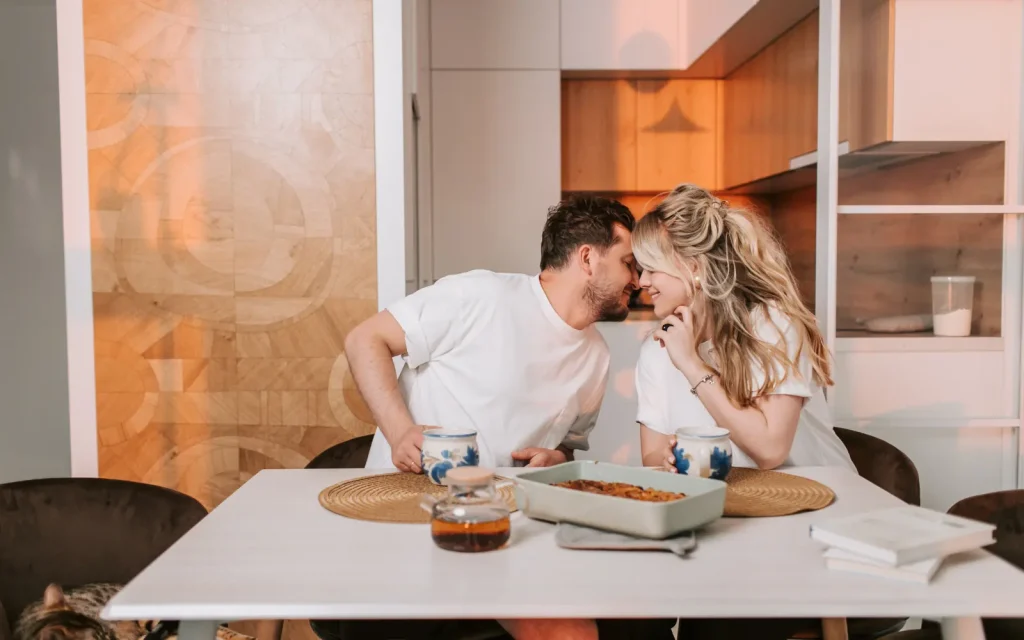 An ADHD-impacted couple eating dinner together, representing the importance of managing ADHD appropriately