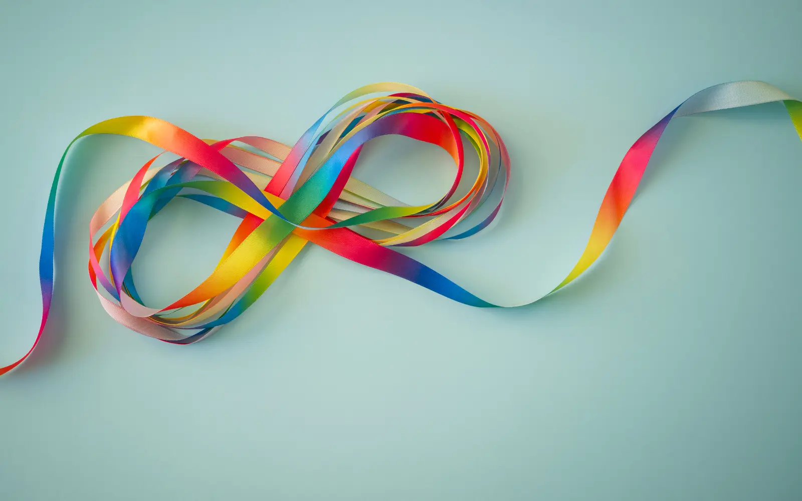 The symbol for neurodiversity formed from a multicoloured ribbon, representing neurodiverse therapy in LA
