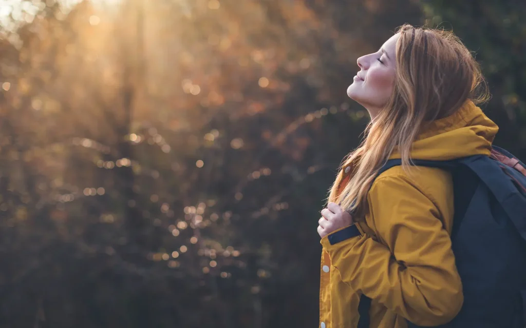 A woman hiking outdoors, representing the positive feelings from neurodiverse therapy in Los Angeles