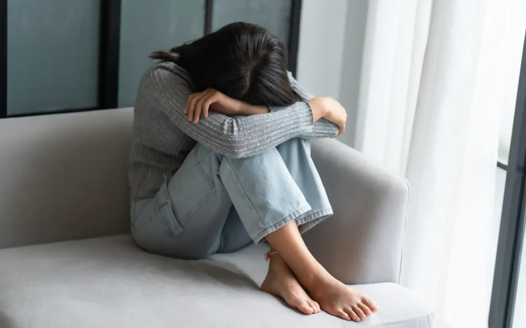 Emotional-paralysis-in-ADHD-couples A woman in emotional paralysis, unable to communicate how she truly feels due to her ADHD symptoms