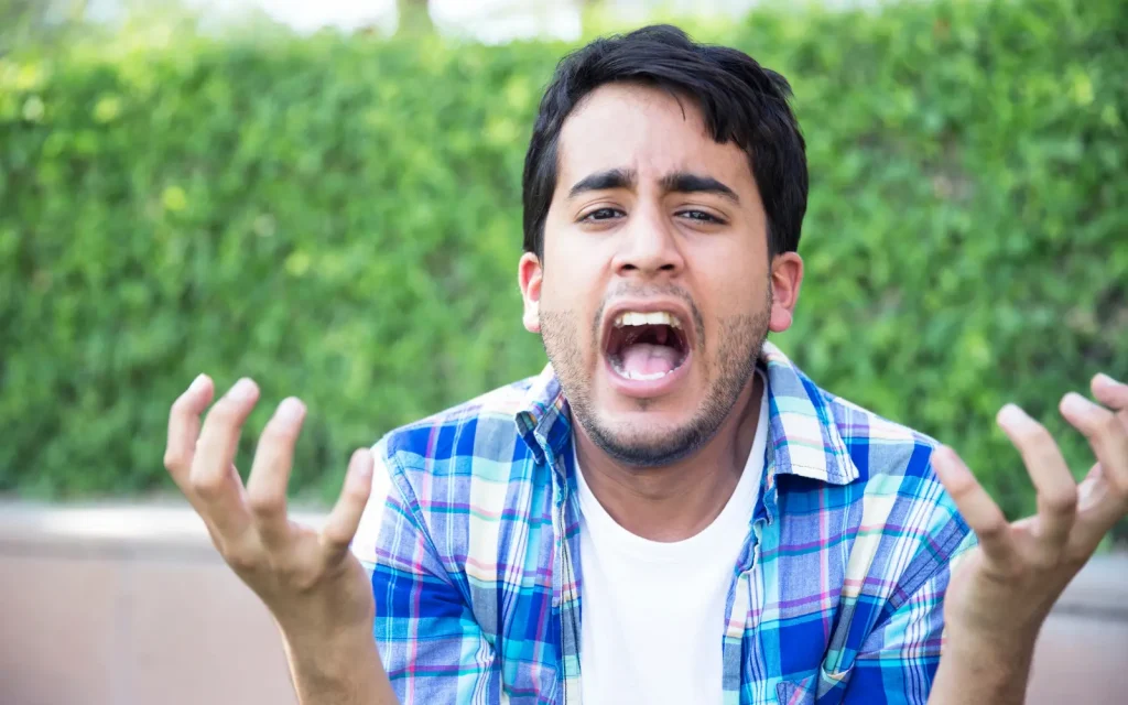 Mood-swings-in-ADHD-burnout An overwhelmed man with ADHD, representing mood swings in ADHD burnout cases