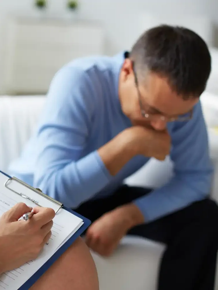 A man crying in a trauma focused CBT session in Los Angeles